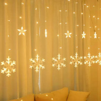 Cortina de luz LED con copos de nieve y estrellas